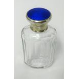 A silver topped scent bottle with blue enamel, height 9cm.