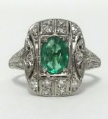 An Art Deco emerald and diamond set ring, in white metal, finger size P.