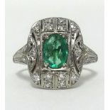 An Art Deco emerald and diamond set ring, in white metal, finger size P.
