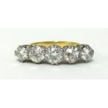 A fine 18ct gold five stone diamond ring with platinum claw settings, set with five graduating old