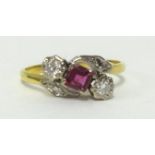 An 18ct ruby and diamond ring. finger size P.