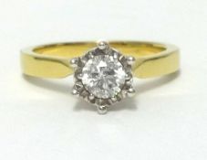 An 18ct diamond solitaire ring, the round cut diamond approx 0.50cts, finger size P.