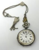 A Victorian silver open face pocket watch with decorative dial, key wined movement.