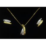 A contemporary 18ct white and yellow gold diamond set pendant and a pair of matching earrings.