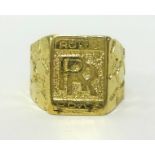 A 14ct gold gents ring, Rolls Royce approx 13.3gms, finger size T.