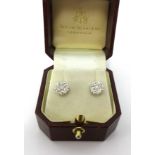 A pair of 18ct white and yellow gold diamond cluster earrings, stud style, hallmarked Edinburgh,