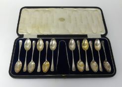 A set of Sheffield silver tea spoons and tongs in fitted case by James Dixon and Son (13 pieces),