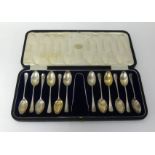 A set of Sheffield silver tea spoons and tongs in fitted case by James Dixon and Son (13 pieces),