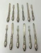 A Victorian twelve setting of dessert eaters and knifes and forks with silver blades.