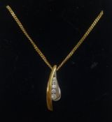 A 9ct white and yellow gold pendant set with a row of five graduating round diamonds, on fine gold
