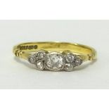 A 18ct gold diamond dress ring set with an arrangement of seven old cut diamonds, ring size J/K.