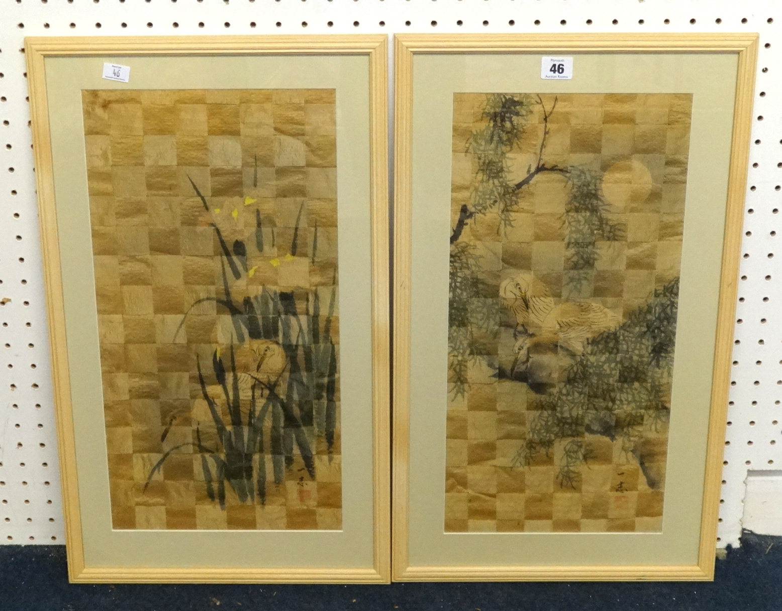 A pair of Chinese silk work pictures of interwoven design depicting birds, 49cm x 24cm.