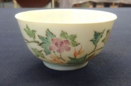 A Chinese porcelain tea bowl decorated with ducks and bright flowers, diameter 7cm.