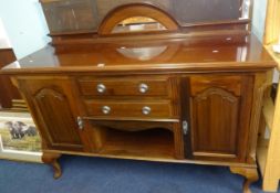 An early 20th century mahogany sideboard with low mirror back.
