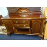 An early 20th century mahogany sideboard with low mirror back.