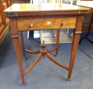 Jas Shoolbred & Co, an Edwardian rosewood and marquetry envelope card table.