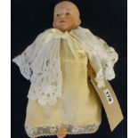 A German bisque head doll (head damaged), marked 'No4' with composition body, height approx 30cm