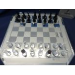 Swarovski Crystal Glass, crystal chess set on mirrored board, boxed.