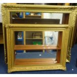 Two wall hanging display shelves with mirror backs set within gilt pictures frames (2), the