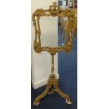 A 19th Century gilt tripod fire screen, height 119cm.