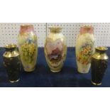 A pair of Doulton Burslem vases decorated in wild flowers one signed C.Hart, the other J.Price