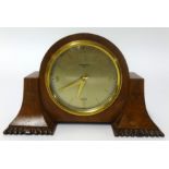 An Elliott walnut cased mantel clock, inscribed 'Carmichael', height 12cm.