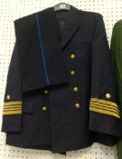 Collection of uniforms including full German Police uniform, Austrian Officer jacket, pair of