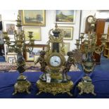 A reproduction imperial ornate three piece clock garniture set decorated with cherubs, gilt work and