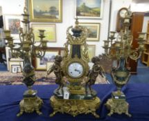 A reproduction imperial ornate three piece clock garniture set decorated with cherubs, gilt work and