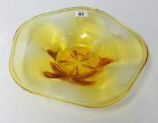 A Whitefriars amber glass bowl of shallow form, 28cm diameter.