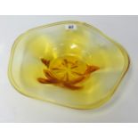 A Whitefriars amber glass bowl of shallow form, 28cm diameter.