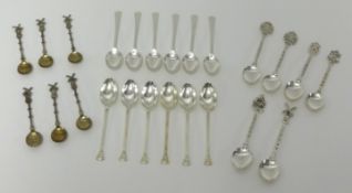 Four sets of tea spoons, including two sets of Geo V silver spoons and two sets of novelty silver