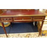 A mahogany brass mounted writing table.