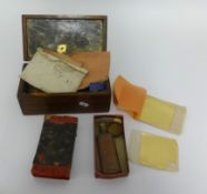 A collection of various old sheets of gold leaf, in wood box.