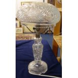 A large all glass table lamp and shade, a small hanging brass bell, Spode and other chinaware,
