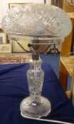 A large all glass table lamp and shade, a small hanging brass bell, Spode and other chinaware,