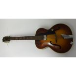 A Hofner six string acoustic guitar, probably circa 1950's, with canvas bag.