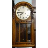 Early 20th Century oak wall clock with eight day movement.