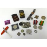A box of various items including coins, two WW11 medals awarded to S.R Blackmore, Plymouth and