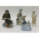 A Royal Copenhagen figure of a Huntsman and Dog, two Lladro figures and another (4).