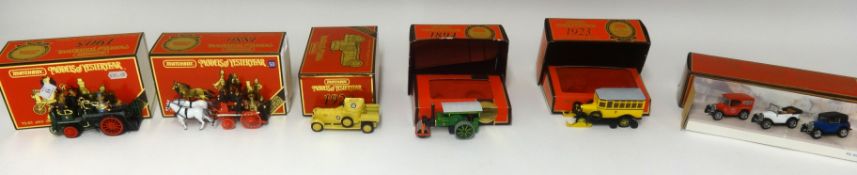 A collection of Matchbox Models of Yesteryear which includes advertising vans and a Y16 Cadillac and