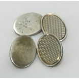 A pair of silver oval gents cufflinks, approx 12.30gms.