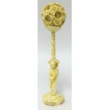A Chinese carved ivory puzzle ball and stand (some damage to the inner balls), height 22cm.