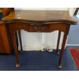 A mahogany fold over table, of 18th century design, with green baize, single drawer, turned legs