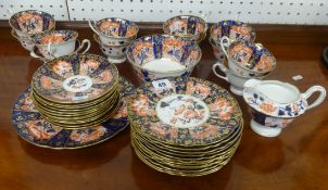 An early 20th Century Foley china twelve setting porcelain tea service of Imari design.