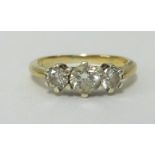 A 9ct gold and three stone diamond ring, total diamond weight approx 0.76cts together with 2007