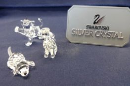 Swarovski Crystal Glass, collection consisting of poodle with box, lion cub and small dog.