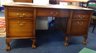An office desk and captains chair