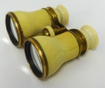 A pair of antique French ivory and brass cased opera glasses.