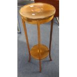 An Edwardian mahogany and inlaid plant stand.